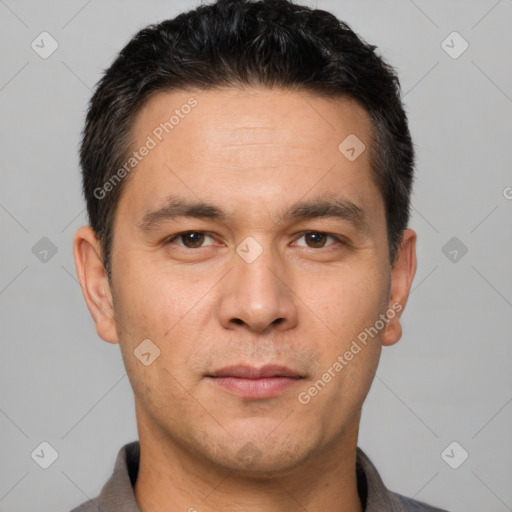 Joyful white young-adult male with short  black hair and brown eyes