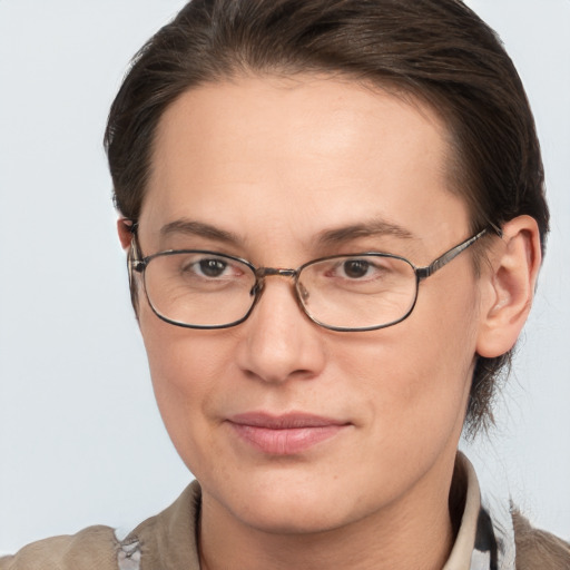 Joyful white adult female with short  brown hair and brown eyes