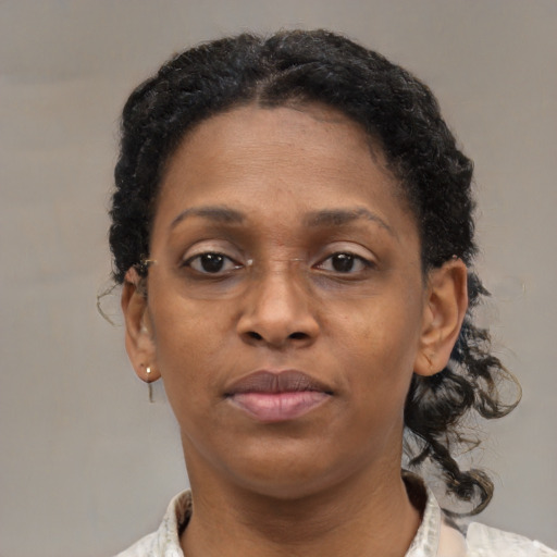 Neutral black adult female with short  brown hair and brown eyes