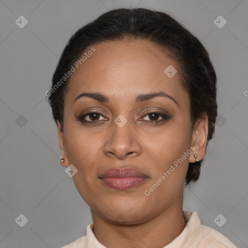 Joyful latino adult female with short  brown hair and brown eyes