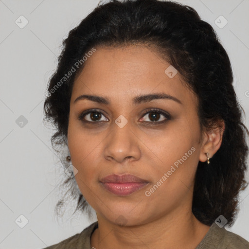 Joyful latino young-adult female with medium  brown hair and brown eyes