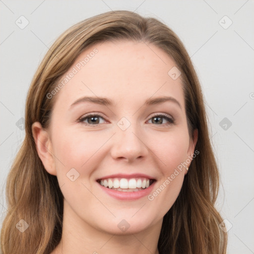 Joyful white young-adult female with long  brown hair and blue eyes