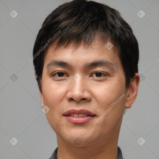 Joyful white young-adult male with short  black hair and brown eyes