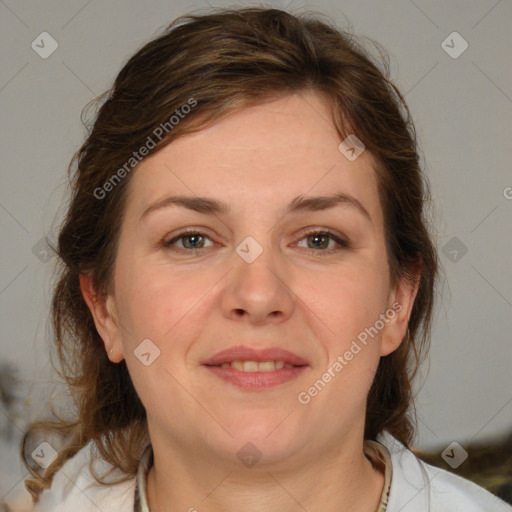 Joyful white adult female with medium  brown hair and blue eyes