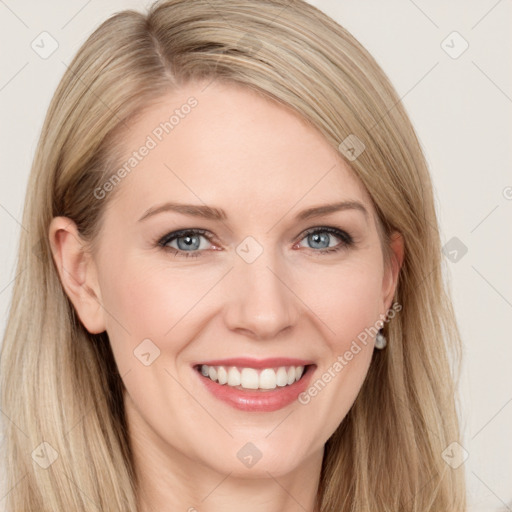 Joyful white young-adult female with long  brown hair and blue eyes