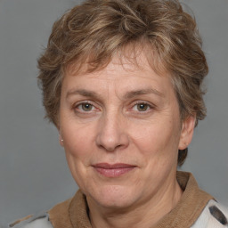 Joyful white adult female with short  brown hair and grey eyes