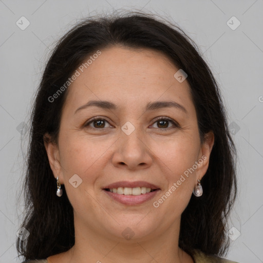 Joyful white adult female with long  brown hair and grey eyes