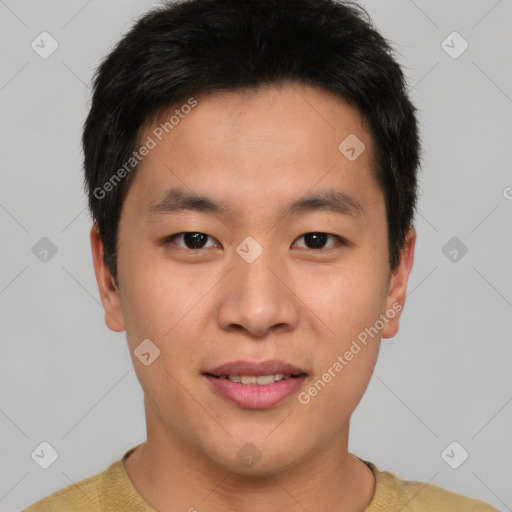 Joyful asian young-adult male with short  brown hair and brown eyes