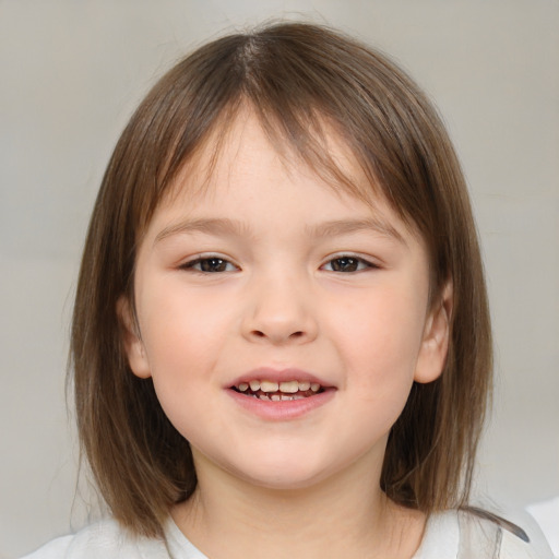 Joyful white child female with medium  brown hair and brown eyes