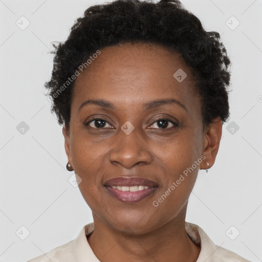 Joyful black adult female with short  brown hair and brown eyes