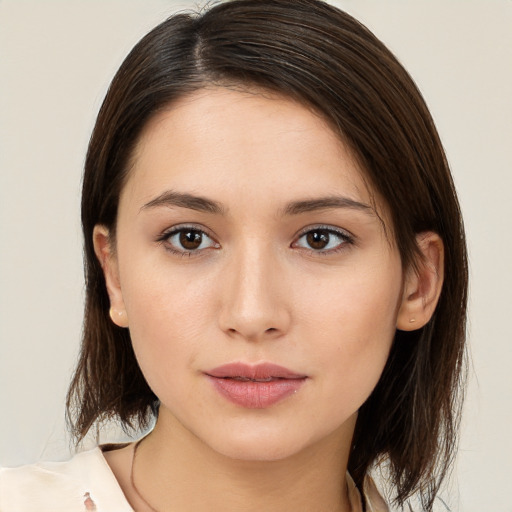 Neutral white young-adult female with medium  brown hair and brown eyes