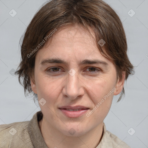 Joyful white adult female with medium  brown hair and grey eyes