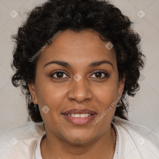 Joyful black adult female with medium  brown hair and brown eyes