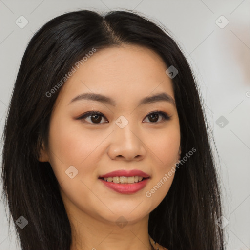 Joyful asian young-adult female with long  brown hair and brown eyes