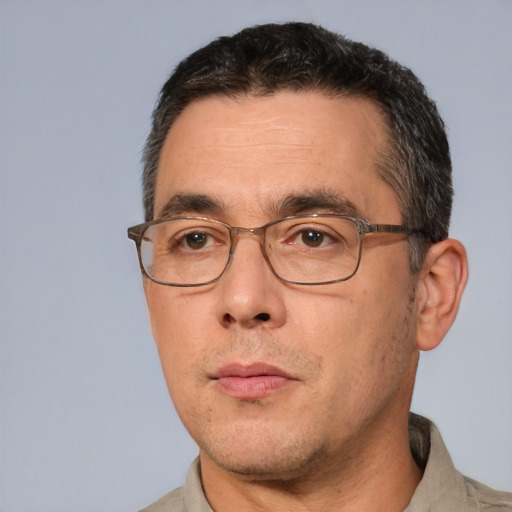 Neutral white adult male with short  black hair and brown eyes