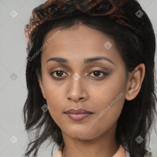 Joyful latino young-adult female with medium  brown hair and brown eyes