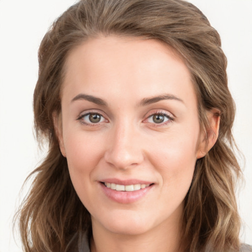 Joyful white young-adult female with long  brown hair and grey eyes