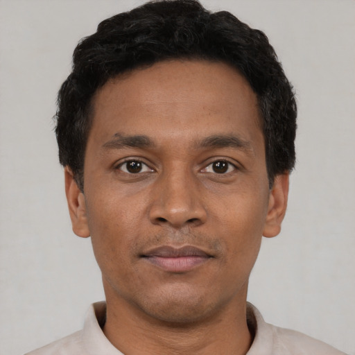 Neutral black young-adult male with short  black hair and brown eyes