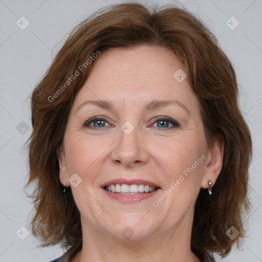 Joyful white adult female with medium  brown hair and grey eyes