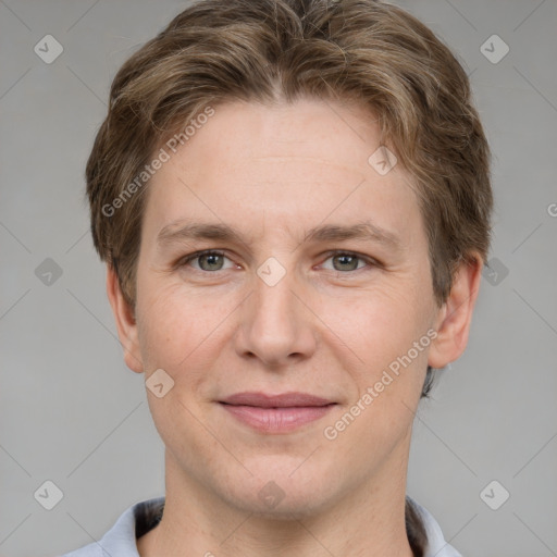 Joyful white adult male with short  brown hair and grey eyes