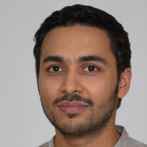 Neutral latino young-adult male with short  black hair and brown eyes