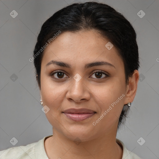 Joyful latino young-adult female with short  brown hair and brown eyes