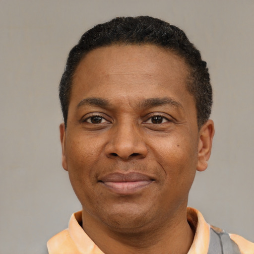 Neutral latino adult male with short  black hair and brown eyes