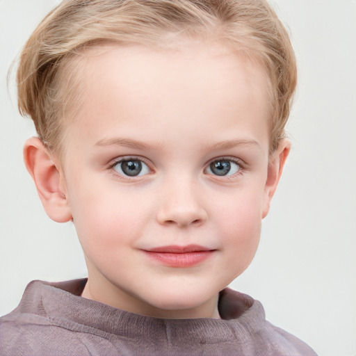 Joyful white child female with short  brown hair and blue eyes