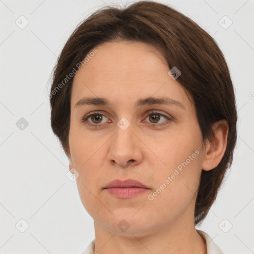 Joyful white adult female with short  brown hair and brown eyes