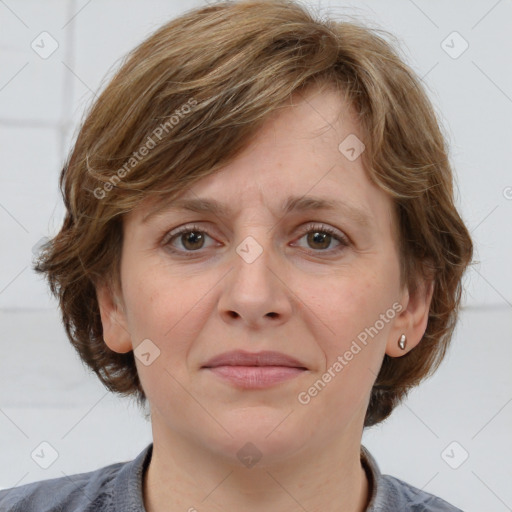 Joyful white adult female with medium  brown hair and grey eyes