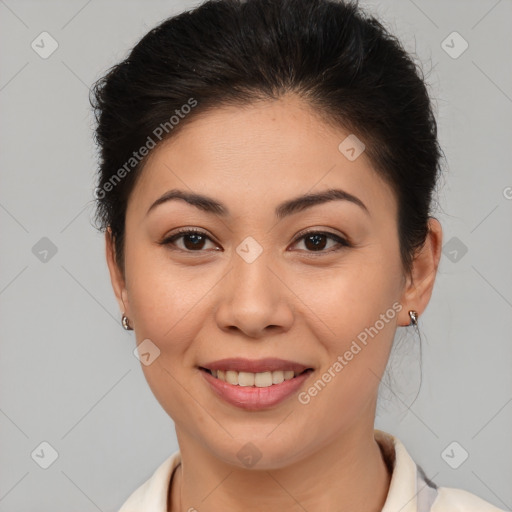 Joyful asian young-adult female with short  brown hair and brown eyes