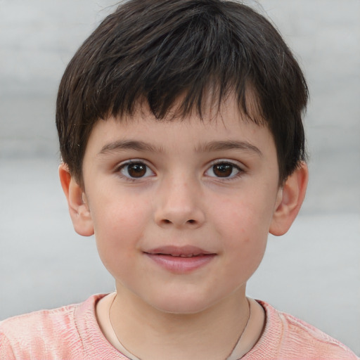 Joyful white child male with short  brown hair and brown eyes