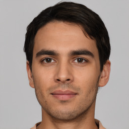 Neutral white young-adult male with short  brown hair and brown eyes
