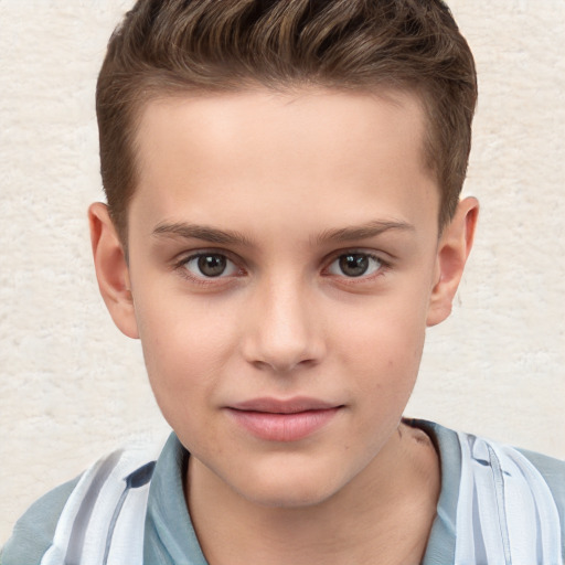 Joyful white child male with short  brown hair and brown eyes