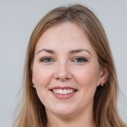 Joyful white young-adult female with long  brown hair and grey eyes