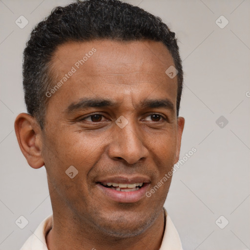 Joyful latino adult male with short  brown hair and brown eyes