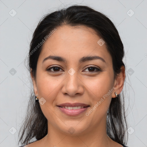 Joyful latino young-adult female with medium  brown hair and brown eyes