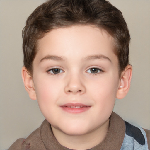 Joyful white child male with short  brown hair and brown eyes