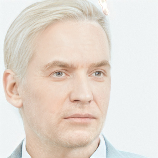 Neutral white adult male with short  gray hair and blue eyes