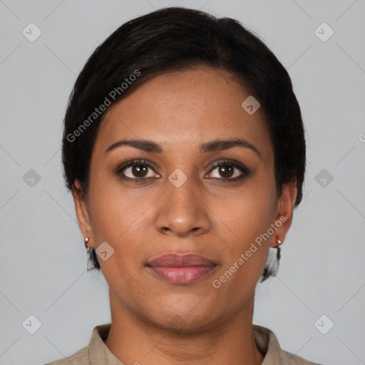 Joyful latino young-adult female with short  black hair and brown eyes