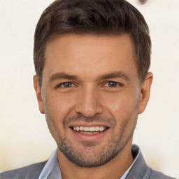 Joyful white young-adult male with short  brown hair and brown eyes