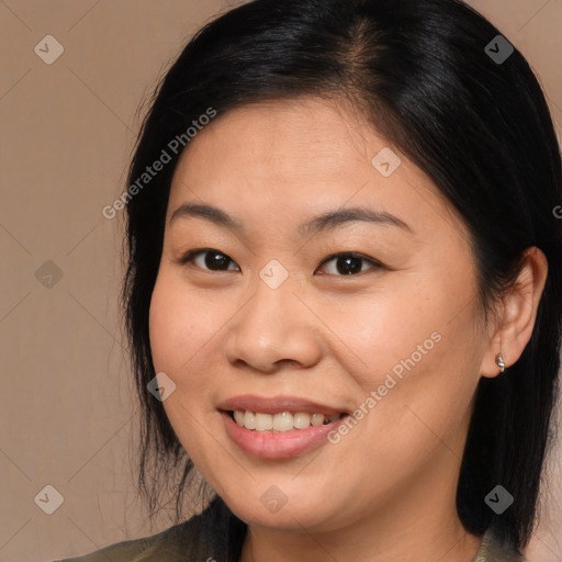 Joyful asian young-adult female with long  brown hair and brown eyes