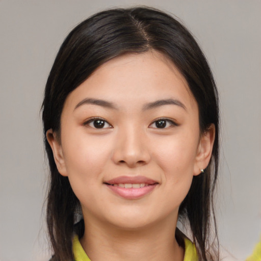 Joyful white young-adult female with medium  brown hair and brown eyes