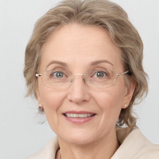 Joyful white middle-aged female with medium  brown hair and blue eyes