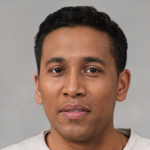 Neutral latino young-adult male with short  black hair and brown eyes
