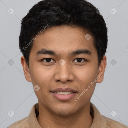 Joyful latino young-adult male with short  brown hair and brown eyes