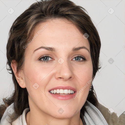 Joyful white young-adult female with medium  brown hair and grey eyes