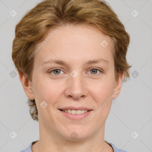 Joyful white adult female with short  brown hair and grey eyes