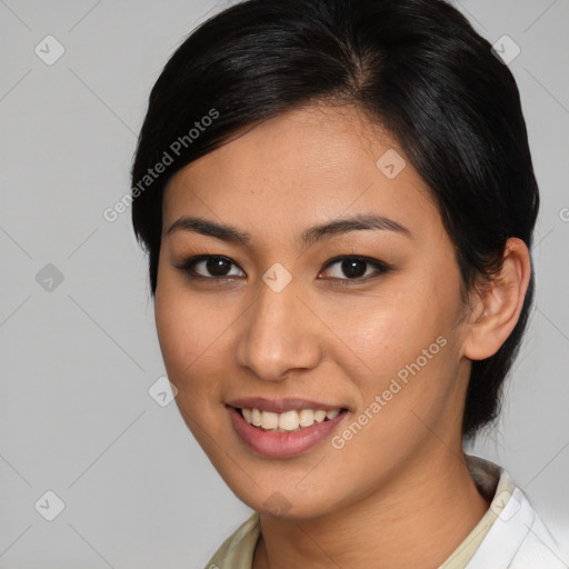 Joyful asian young-adult female with medium  brown hair and brown eyes