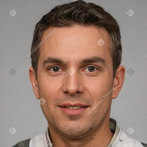 Joyful white adult male with short  brown hair and brown eyes